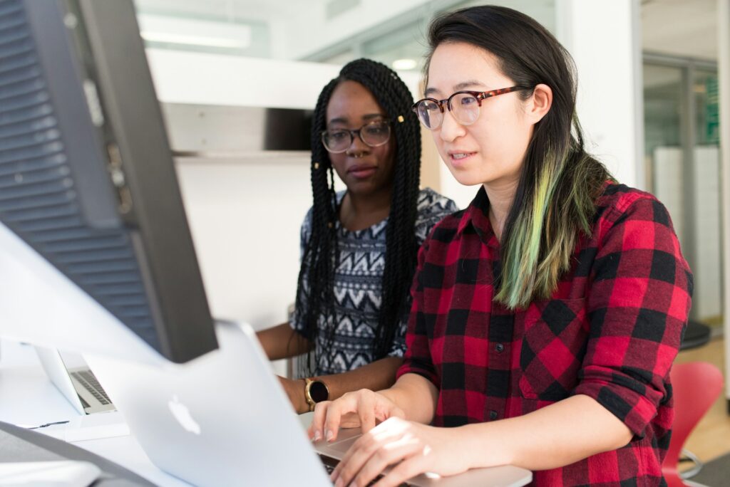 Two women working on a computer